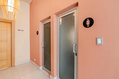 a hallway with a glass door in a building at Cozy Apartment near Downtown Center in Santo Domingo
