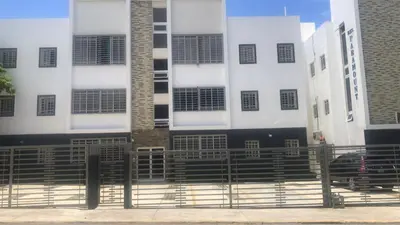 a building with a fence in front of it at Paramount 3-Bedroom Apartment with Parking in San Felipe de Puerto Plata