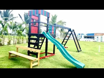 a playground with a slide and a bench at Cana Rock Chic Golf de Lux in Punta Cana
