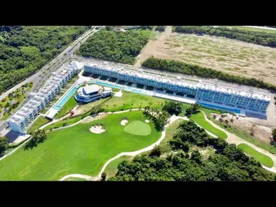 an aerial view of a golf course with a resort at Cana Rock Chic Golf de Lux in Punta Cana