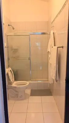 a bathroom with a shower and a toilet in it at Lovely location , right downtown Puerto Plata in San Felipe de Puerto Plata