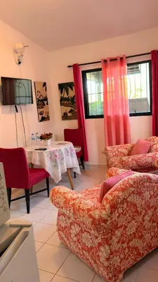 a living room with a couch and a table at Lovely location , right downtown Puerto Plata in San Felipe de Puerto Plata