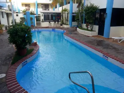a large blue swimming pool in a hotel at Apartamentos in Condo Plaza Europa in Sosúa