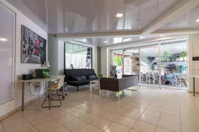 a living room with a couch and a table at Apartamentos in Condo Plaza Europa in Sosúa