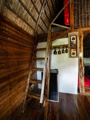 an attic room with a staircase in a house at Valle Bucana in Santa Bárbara de Samaná