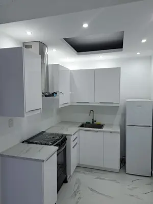 a white kitchen with white cabinets and a sink at CASA MARAVILLOSA in Bayahibe