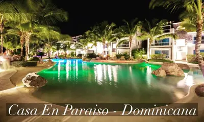 a swimming pool at a resort at night at Casa en Paraiso RD in Bayahibe
