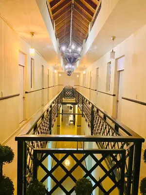 an empty hallway with benches in a building at RIG Casa Conde in Santo Domingo