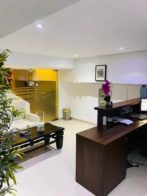 an office with a desk and a living room at RIG Casa Conde in Santo Domingo