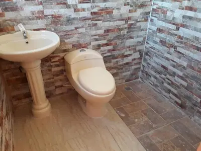 a bathroom with a toilet and a sink at Apartahotel Next Nivel - Queen Room in Punta Cana