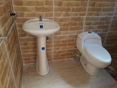 a bathroom with a sink and a toilet at Apartahotel Next Nivel - Queen Room in Punta Cana
