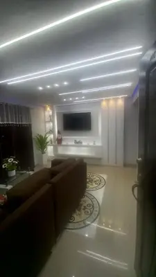 a living room with a couch and a flat screen tv at SANTIAGO PARADISE 111 S 3 in Santiago de los Caballeros