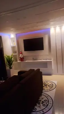 a living room with a couch and a flat screen tv at SANTIAGO PARADISE 111 S 3 in Santiago de los Caballeros