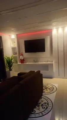 a living room with a couch and a flat screen tv at SANTIAGO PARADISE 111 S 3 in Santiago de los Caballeros