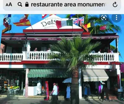 a building with a palm tree in front of it at 7DR Apt in Prime Location Near Monumental Area in Santiago de los Caballeros
