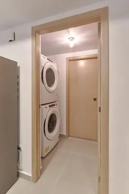 a laundry room with a washer and dryer at Dom. Rep. Exclusive 2 bed Apt. Evaristo Morales in Santo Domingo