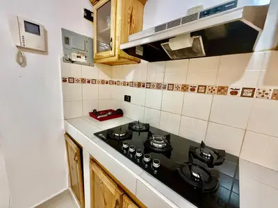 a kitchen with a stove top oven in a kitchen at Apartment Travis l in La Viva
