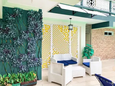 a mural of flowers on the wall of a lobby at Hotel Sinai in Nagua