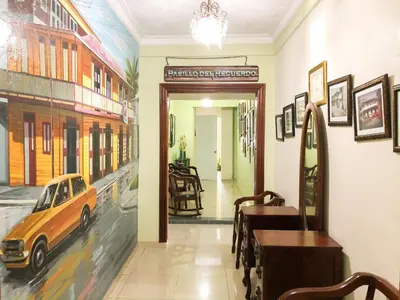 a dining room with a car on the window of a restaurant at Hotel Sinai in Nagua