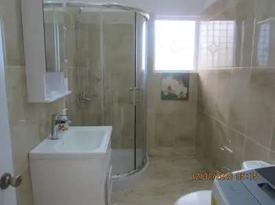a bathroom with a shower and a toilet and a sink at Pelicano Tropical Paraiso Samana in Santa Bárbara de Samaná
