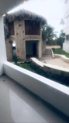 a view of a building from the outside of a window at Apartamento estudio frente al mar in Guayacanes
