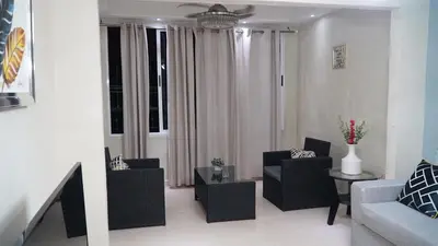 a living room with two chairs and a couch at Vistabalcon Aire y Neflix in La Guáyiga