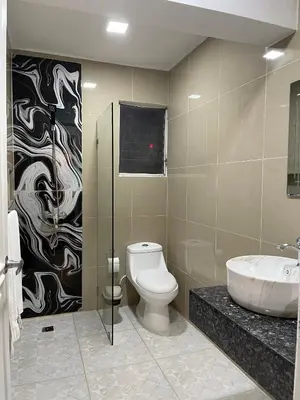 a bathroom with a toilet and a sink at Villa Iguana in Bayahibe