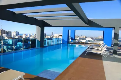 a swimming pool on the roof of a building with a view at S1404 Vista espectacular Downtown Santo Domingo in Santo Domingo