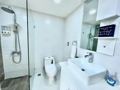 a bathroom with a toilet and a sink and a shower at Las Terrenas beachfront 2 bedrooms condo with pool in Las Terrenas