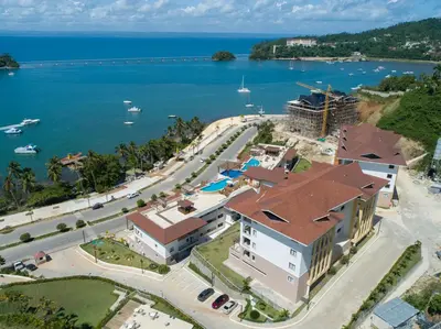 an aerial view of a resort and the ocean at Hacienda Samana Bay Hotel in Santa Bárbara de Samaná