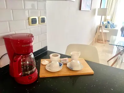 a red blender sitting on top of a table at Cana Rock De Lujo 344 Vista Al Campo De Golf in Punta Cana