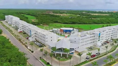 an aerial view of a large white building at Cana Rock 108 Acceso Directo Piscina Punta Cana in Punta Cana