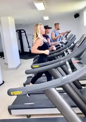 a group of people on treadmills in a gym at Apartamento 120 Jardin Privado Cana Rock in Punta Cana