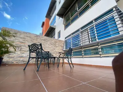 two black chairs sitting on top of a building at LEAN LUXURY Santo Domingo in Santo Domingo