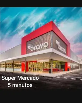 a store with a sign that saysacco super mecca minutes at 3bed Apartment con Terraza y Picsina privada in Santo Domingo