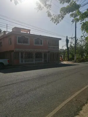 a building on the side of a street with a road at Las colinas de Samaná in Santa Bárbara de Samaná