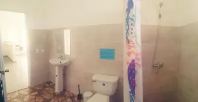 a bathroom with a toilet and a sink and a shower at Casa A&A in Las Galeras