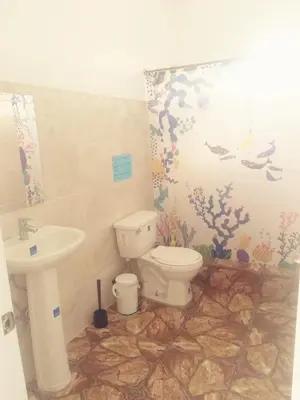 a bathroom with a toilet and a sink at Casa A&A in Las Galeras