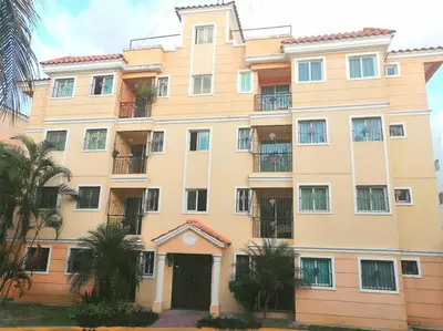 a large yellow building with balconies on it at Acogedor-Hermoso apart completo equipado de 2 hab. in Santiago de los Caballeros