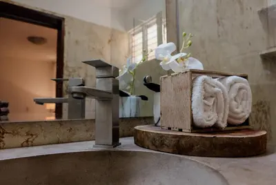 a bathroom with a sink and a faucet at Villa Dylan Samana, Luxury 3Br with pool in Santa Bárbara de Samaná