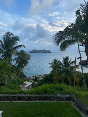 a view of the ocean with a island in the distance at Vista Mare Samana The Best View!! in Santa Bárbara de Samaná