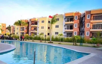 a swimming pool in front of some apartment buildings at Paradise s-1 3 in Santiago de los Caballeros