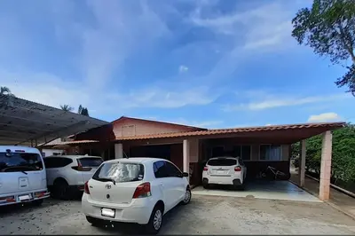 two cars parked in front of a house at CASITA HOGAREÑA JARABACOA (independent entrance) in Jarabacoa