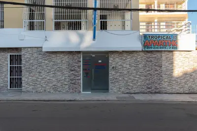 a building with a sign on the side of it at Cozy One Bedroom Apartment in Santo Domingo Este in La Viva