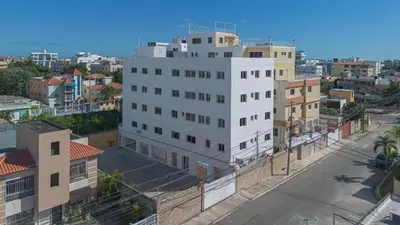 an overhead view of a white building in a city at Modern Studio Near Airport Fast WiFi Generator in La Viva
