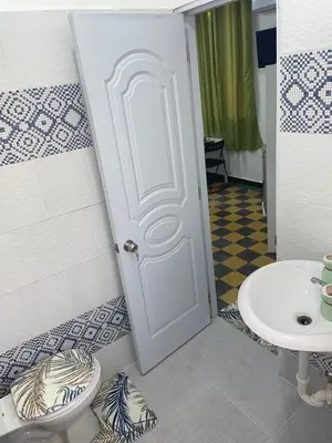 a bathroom with a toilet and a sink at Habitación Independiente Zona Colonial in Santo Domingo