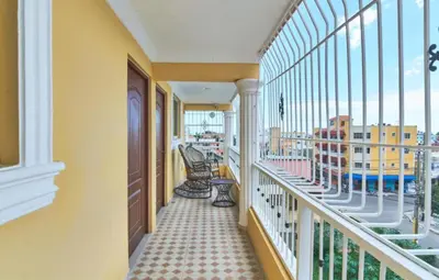 a balcony with a view of a building at Cozy Apartment Near Airport Wi-Fi & Parking in La Viva