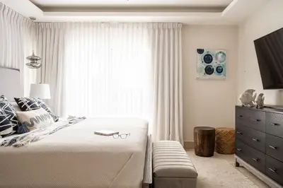 a bedroom with a large bed and a window at Cofresi Hills Residence in Gurapito