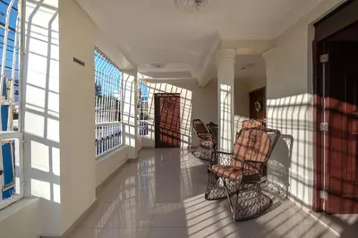 a hallway with chairs and windows in a building at Spacious 2Br 1Bath Apartment Terrace & Street View in La Viva