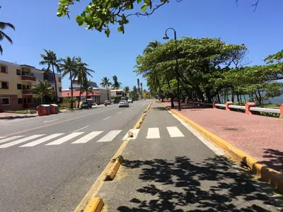 an empty street with a crosswalk in a city at Cozy Studios-Private Entrance- HS Internet-AC-Hot Water-Backup Generator-near the Beach in San Felipe de Puerto Plata
